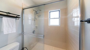 how to clean between sliding shower doors